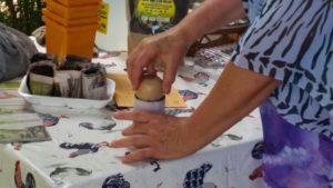 Margie Demonstrating how easy it is to make recycled pots for planting seeds