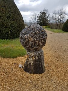 Chateau Verteuil -magnificent historical living chateau-a cannon ball from ancient times is now a garden feature. 