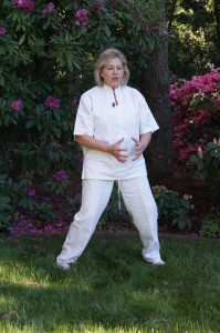 Margie Hare performing a Qi Gong warm up exercise